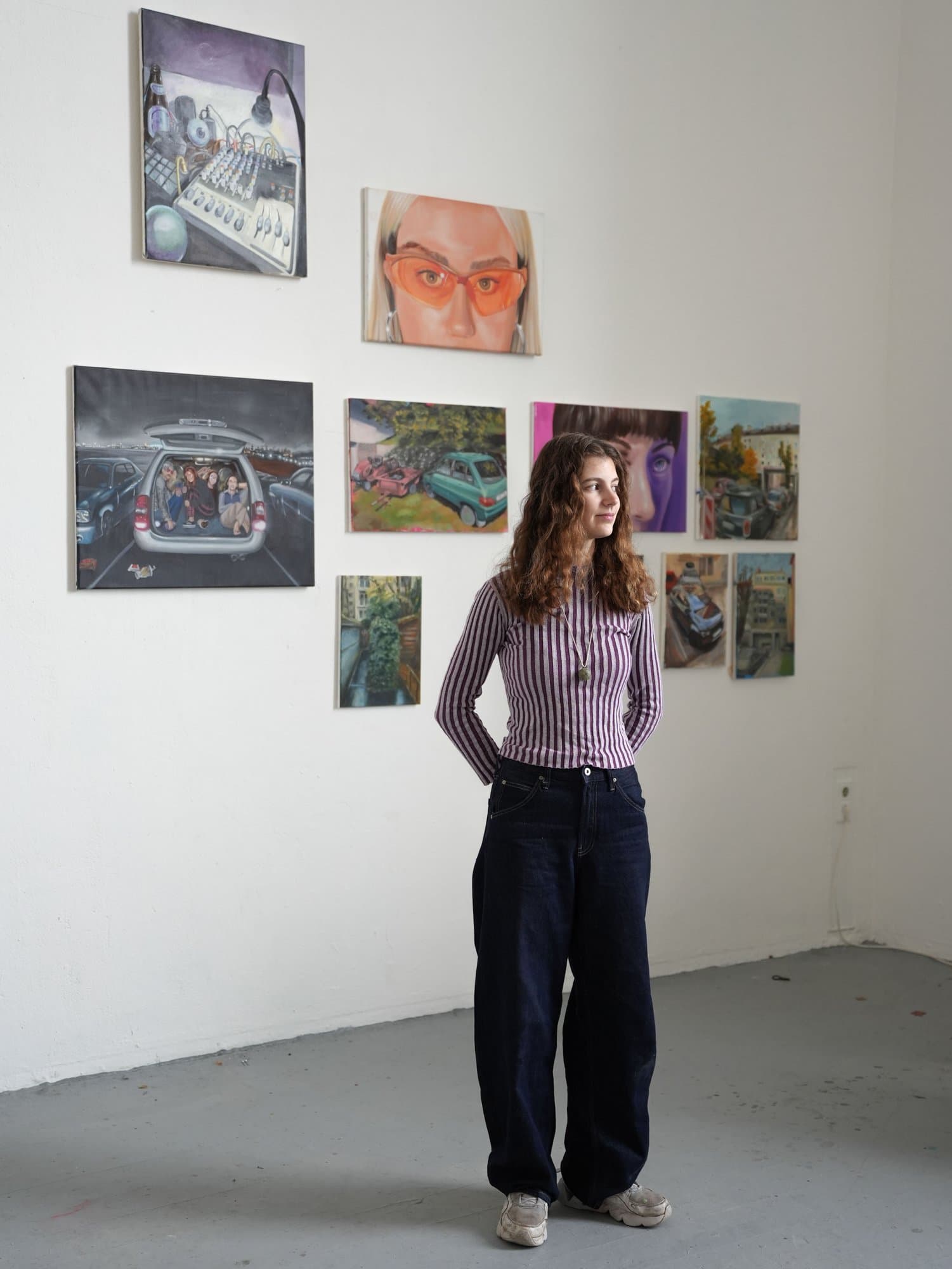 Jodi Smith in her studio in front of her paintings