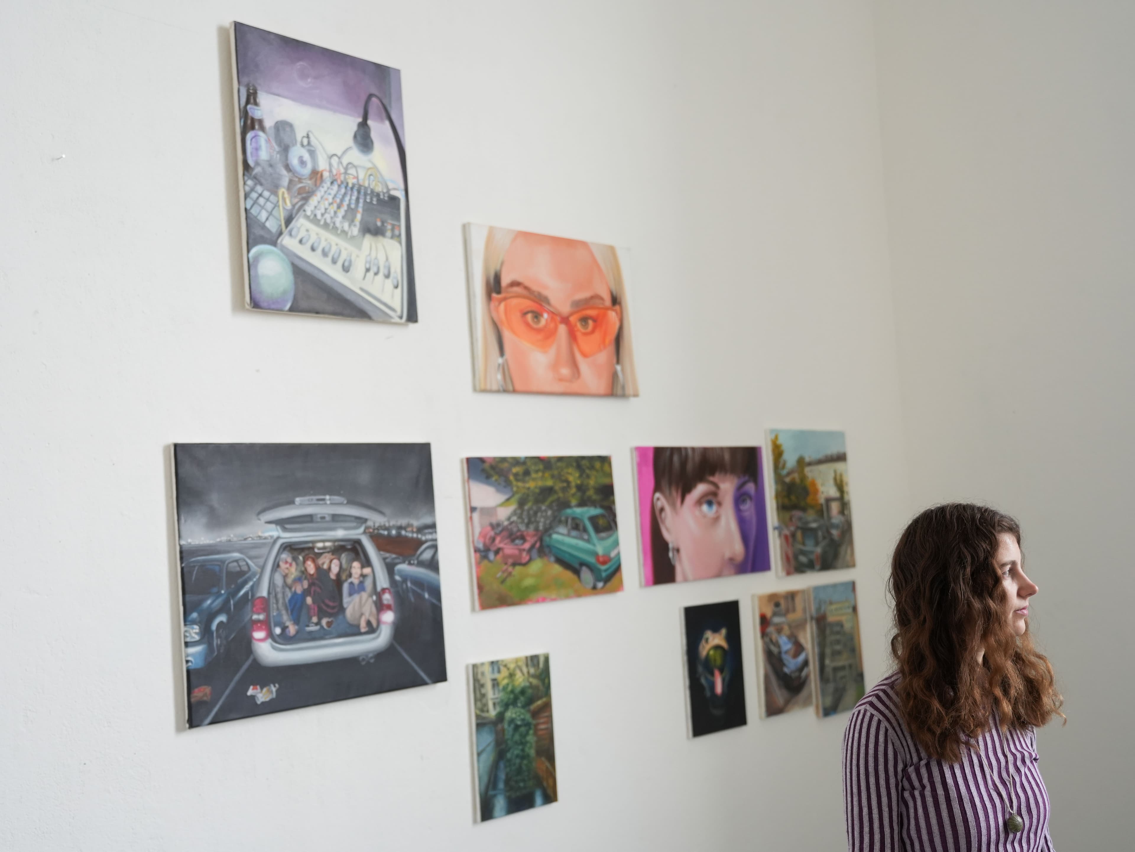 Jodi Smith in her studio in front of her paintings